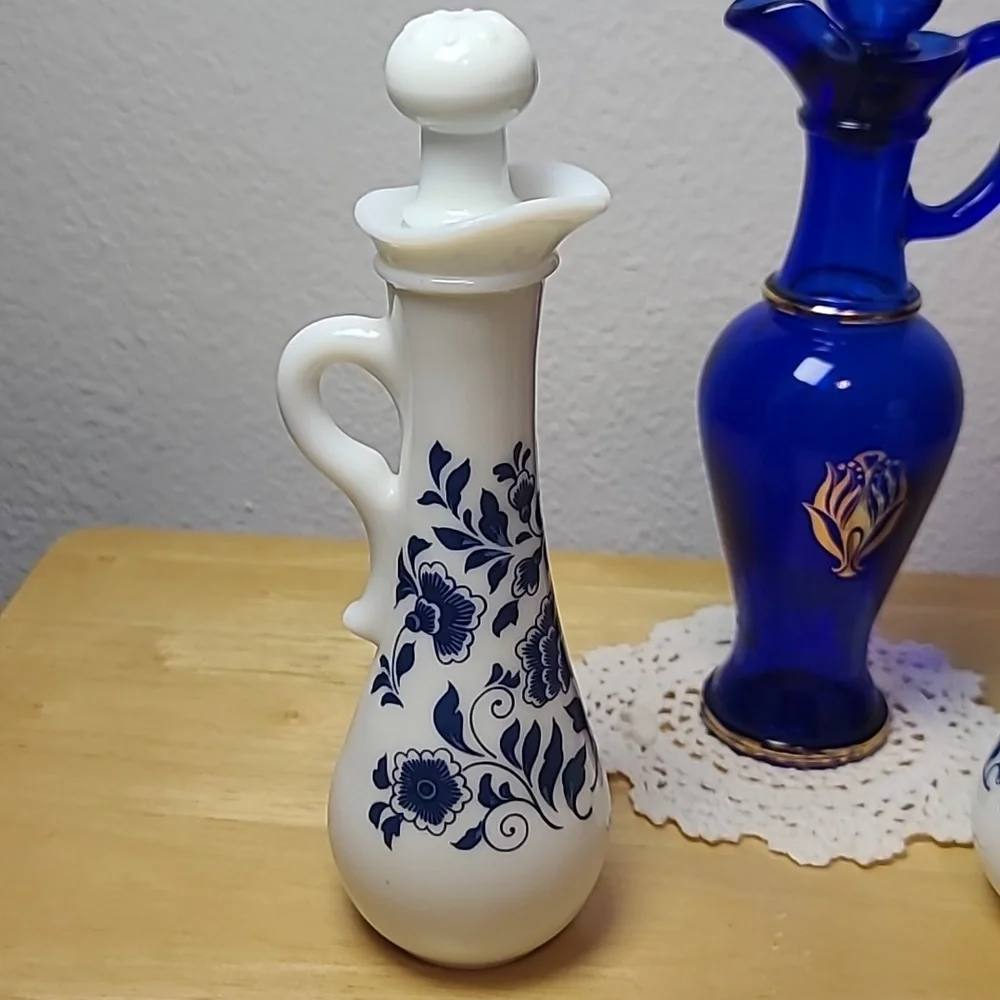 Avon set of three milk glass and blue glass pitcher.